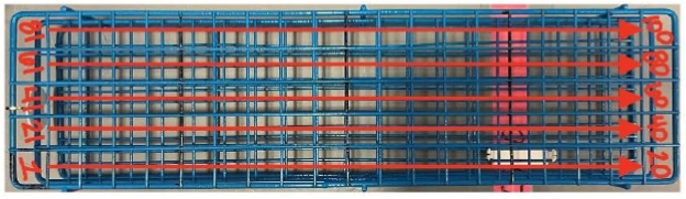 Metal sample rack with blood collection tubes arranged sequentially in a grid pattern.